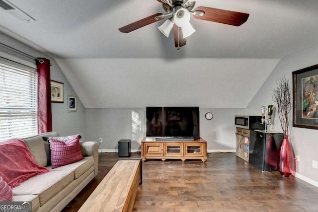 living room featuring dark hardwood / wood-style floors, ceiling fan, and lofted ceiling