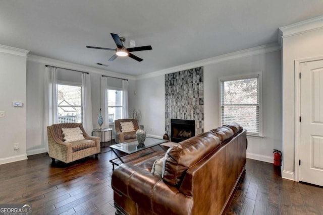 living room with ceiling fan, dark hardwood / wood-style flooring, and ornamental molding