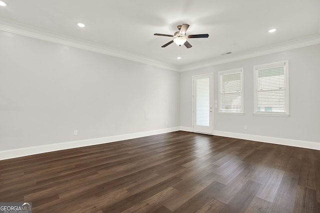 empty room featuring ceiling fan, dark wood-type flooring, and ornamental molding