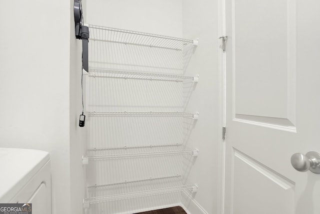 pantry with independent washer and dryer