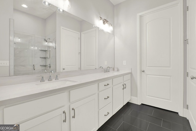 bathroom with tile patterned floors, vanity, and a shower with shower door