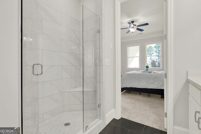 bathroom with vanity, tile patterned floors, ceiling fan, ornamental molding, and an enclosed shower