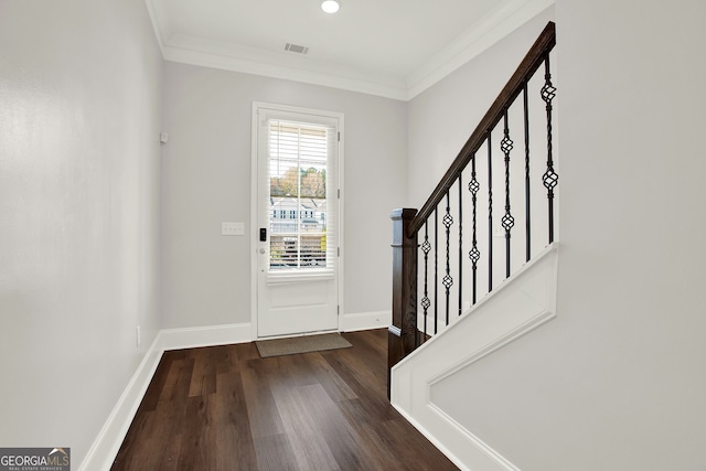 entryway with crown molding and dark hardwood / wood-style floors