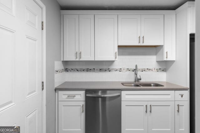 kitchen with dishwasher, white cabinets, and sink