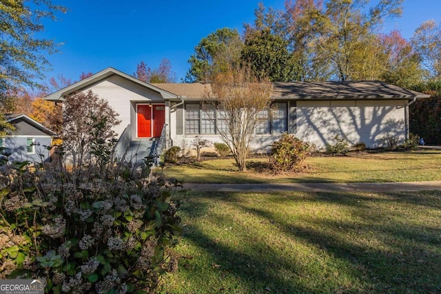 ranch-style house with a front lawn