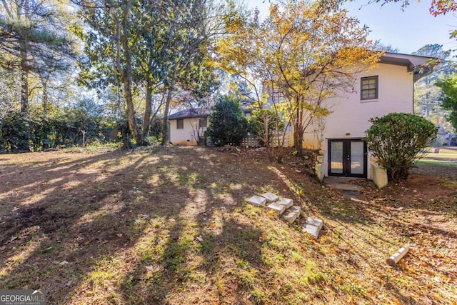 view of yard featuring french doors