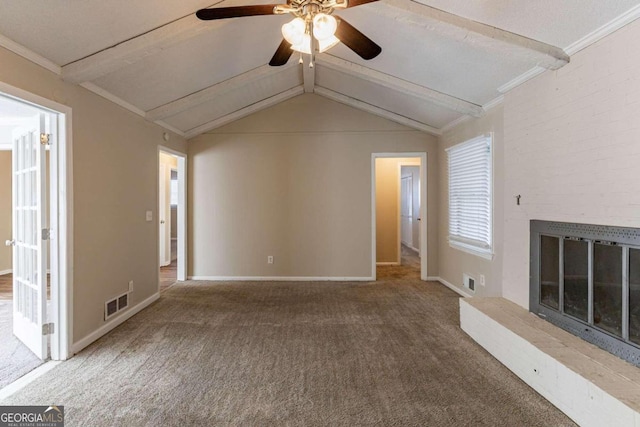 unfurnished living room with vaulted ceiling with beams, carpet floors, ceiling fan, and ornamental molding