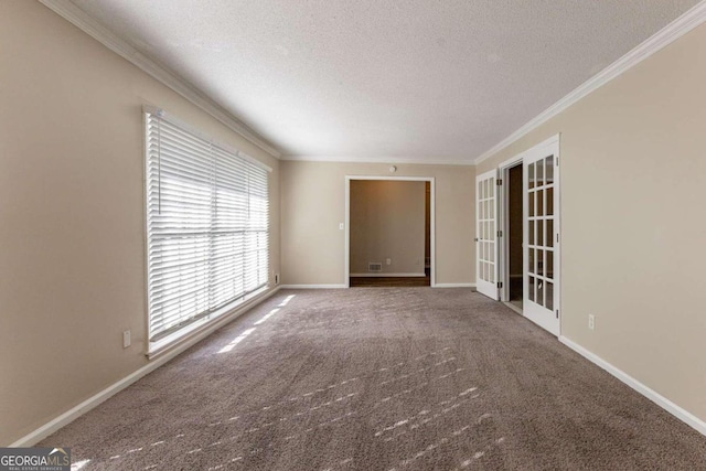 unfurnished room with carpet flooring, crown molding, a textured ceiling, and french doors