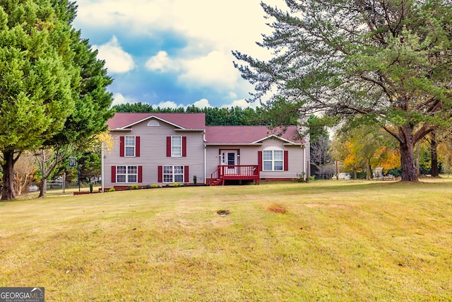 view of front of home featuring a deck and a front lawn