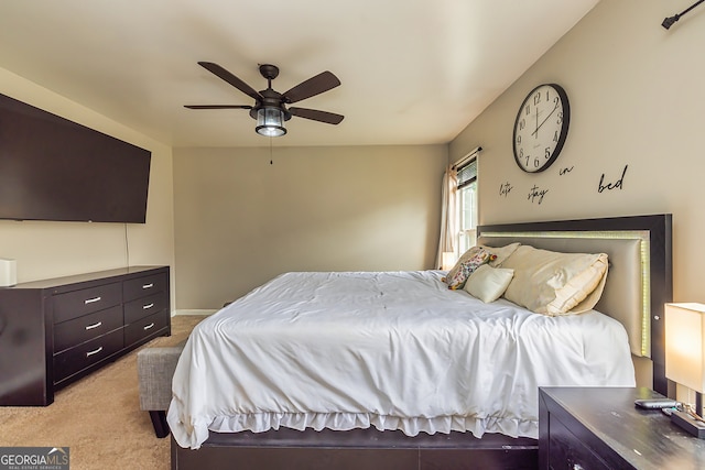 bedroom featuring light colored carpet and ceiling fan