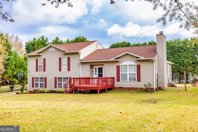 view of front facade with a deck and a front lawn