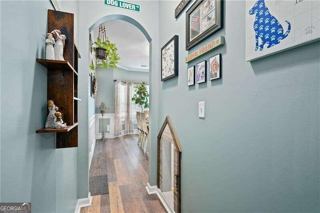 hall with wood-type flooring