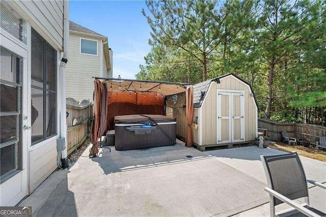 view of patio / terrace with a hot tub