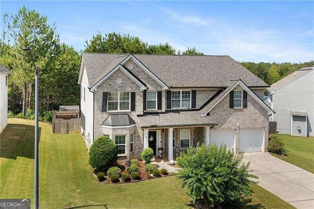 view of front facade with a garage and a front lawn