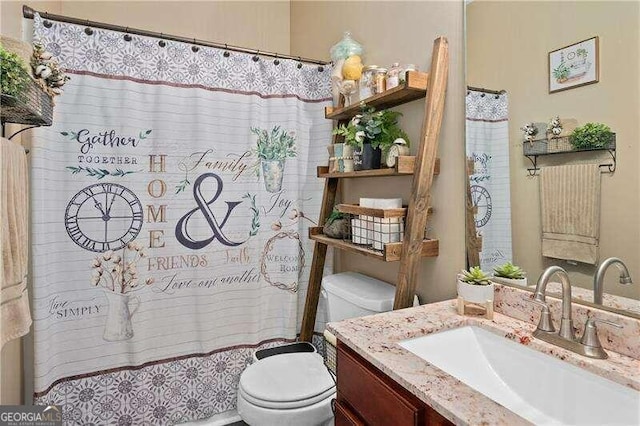 bathroom with vanity and toilet