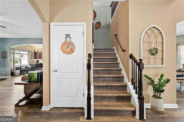 stairway with wood-type flooring