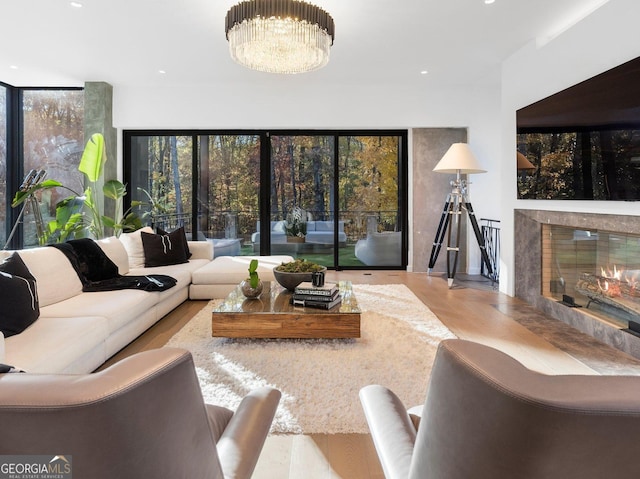 living room with a fireplace and a chandelier