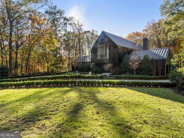 view of property exterior featuring a yard