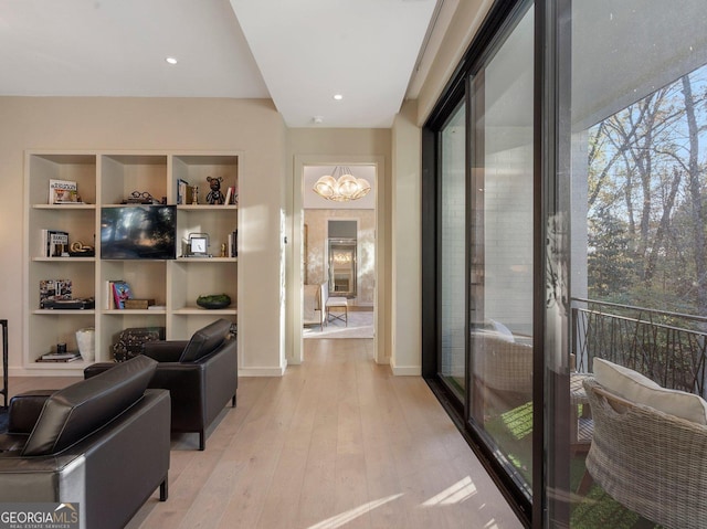 interior space featuring light hardwood / wood-style flooring and a chandelier