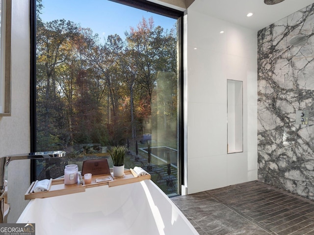 bathroom featuring tile walls