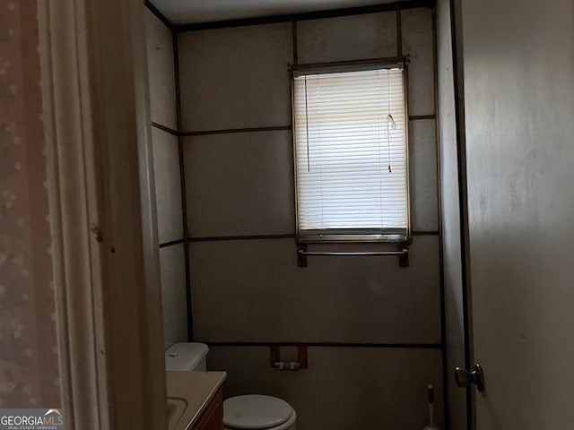 bathroom with vanity and toilet