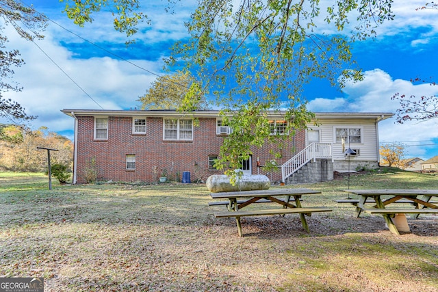 back of house with a yard