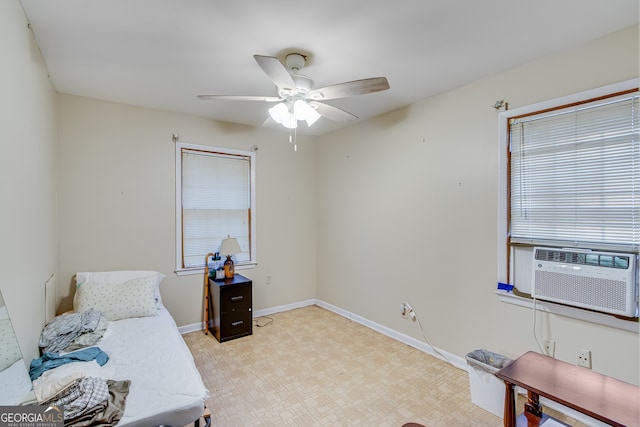 bedroom with ceiling fan and cooling unit