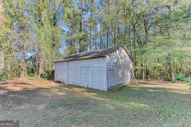 garage featuring a yard