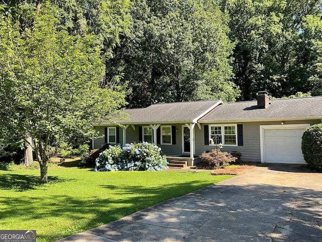 ranch-style home featuring a front lawn and a garage