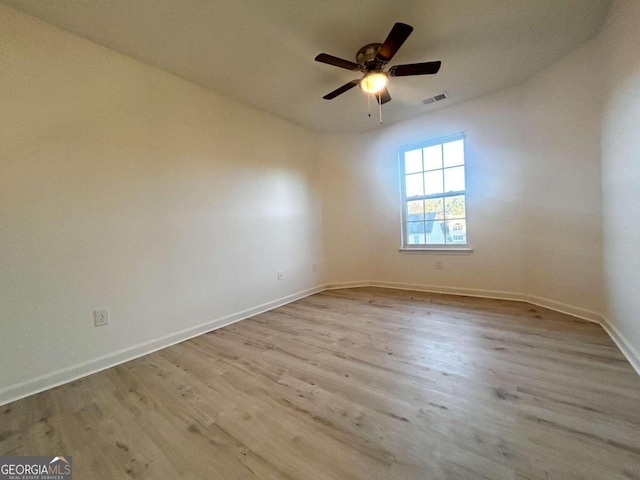 unfurnished room with ceiling fan and light hardwood / wood-style floors