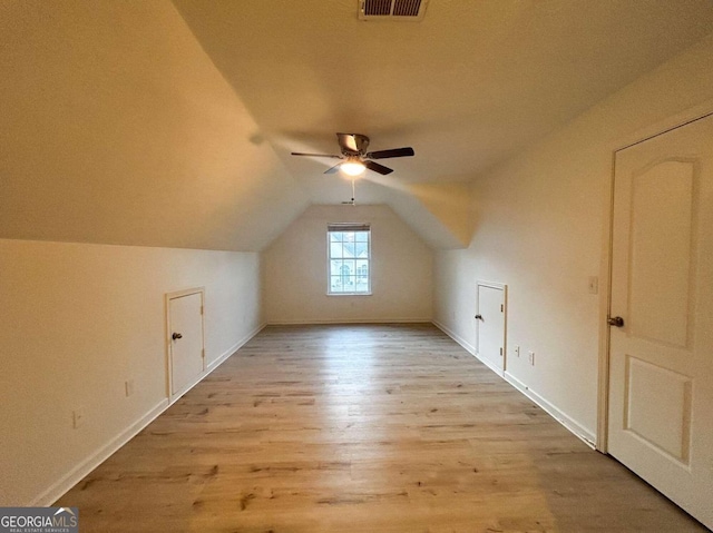 bonus room featuring ceiling fan, light wood-type flooring, and vaulted ceiling