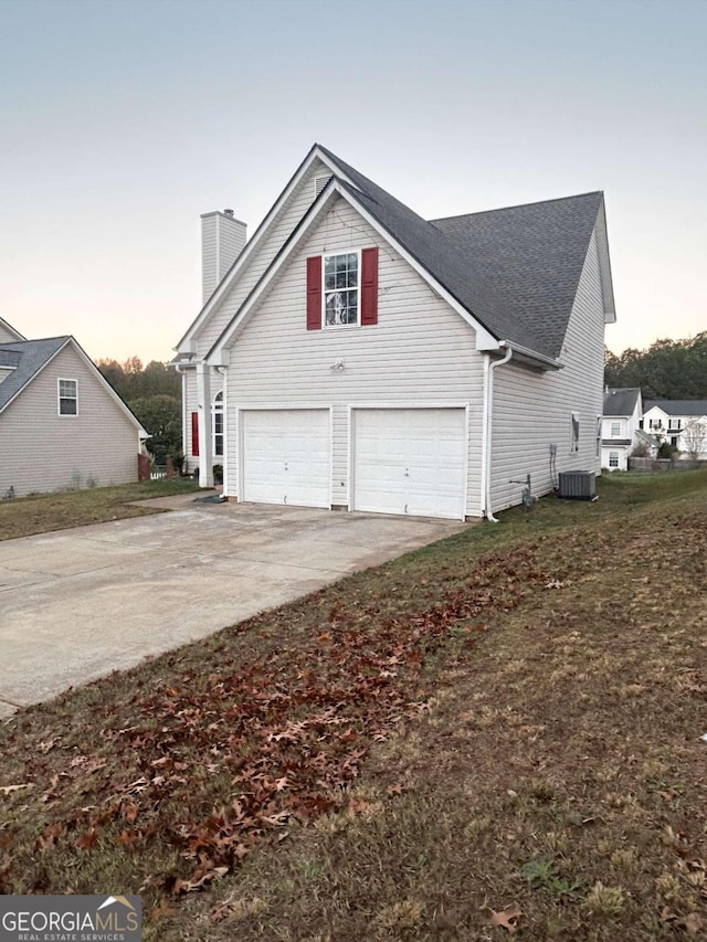 property exterior at dusk with a garage