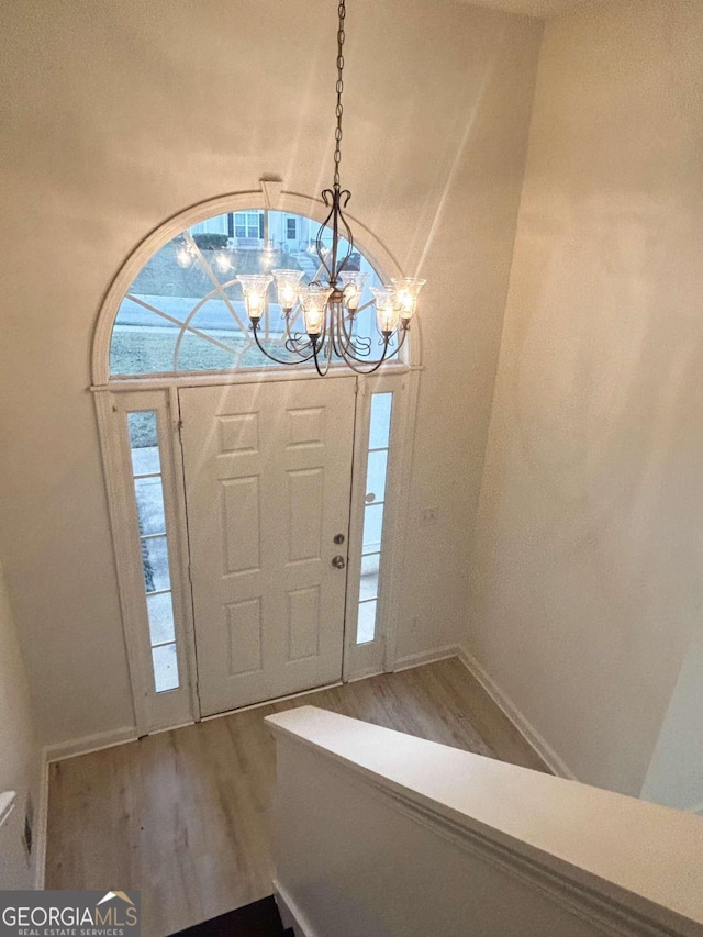 entryway with a chandelier and hardwood / wood-style floors