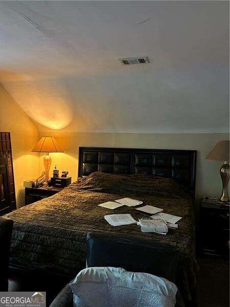 bedroom featuring lofted ceiling