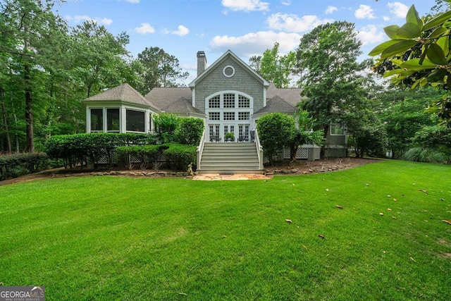 back of house with a yard