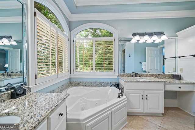 bathroom featuring tile patterned flooring, a washtub, vanity, and ornamental molding