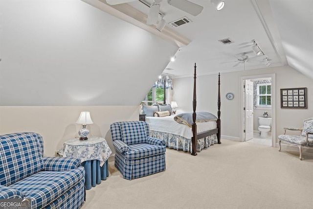 bedroom with carpet flooring, connected bathroom, vaulted ceiling, and ceiling fan