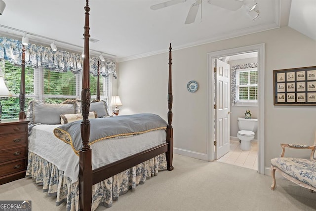 carpeted bedroom featuring ensuite bathroom, ceiling fan, lofted ceiling, and crown molding