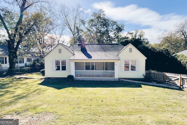 view of front facade with covered porch and a front yard