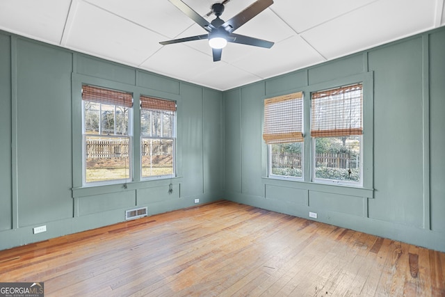 empty room featuring ceiling fan and light wood-type flooring