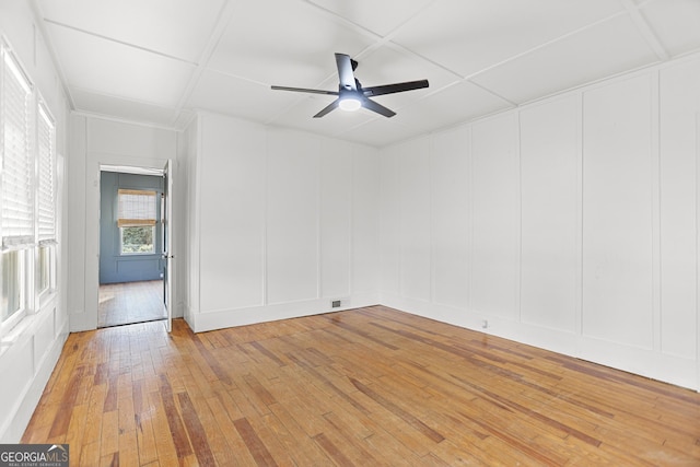 unfurnished room featuring hardwood / wood-style flooring and ceiling fan