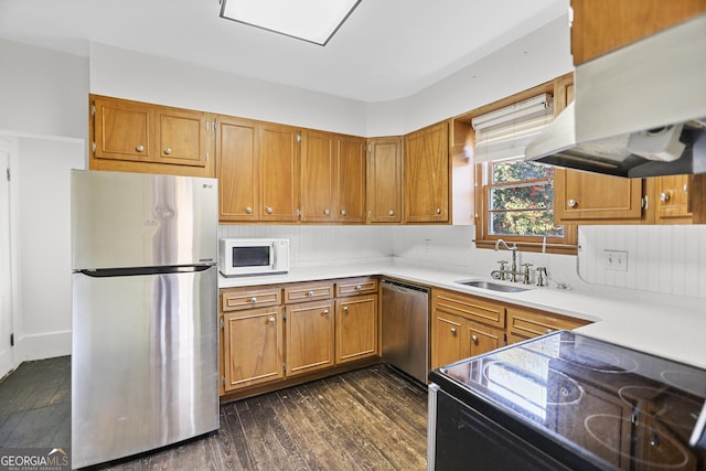 kitchen featuring sink, dark wood-type flooring, and stainless steel appliances