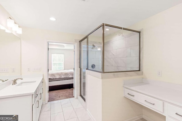 bathroom with vanity and a shower with door