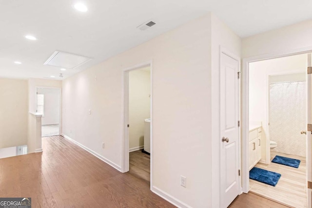 hallway featuring hardwood / wood-style flooring