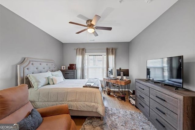 bedroom featuring light hardwood / wood-style flooring and ceiling fan