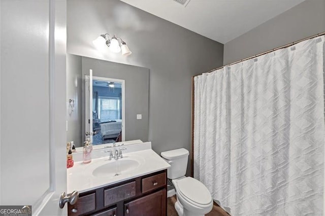 bathroom with vanity and toilet