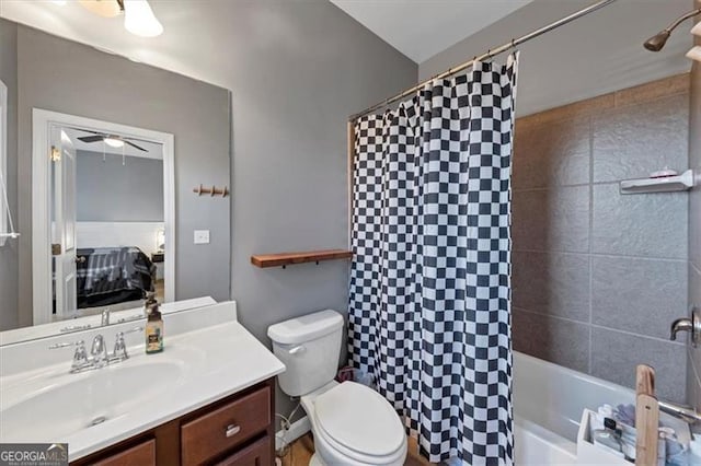 full bathroom with shower / bath combination with curtain, vanity, and toilet