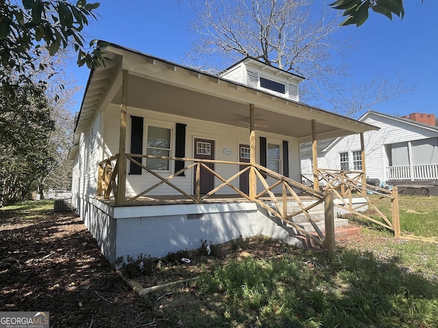 view of front of house featuring covered porch, crawl space, and cooling unit