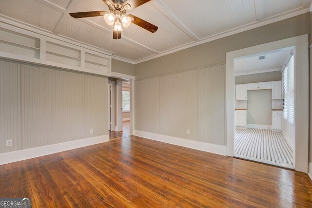 31 N Broad St, Porterdale, GA 30014 - spare room with a ceiling fan, dark wood finished floors, ornamental molding, and baseboards
