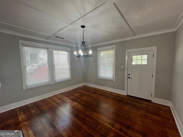 foyer entrance with crown molding, dark wood-type flooring, and a healthy amount of sunlight